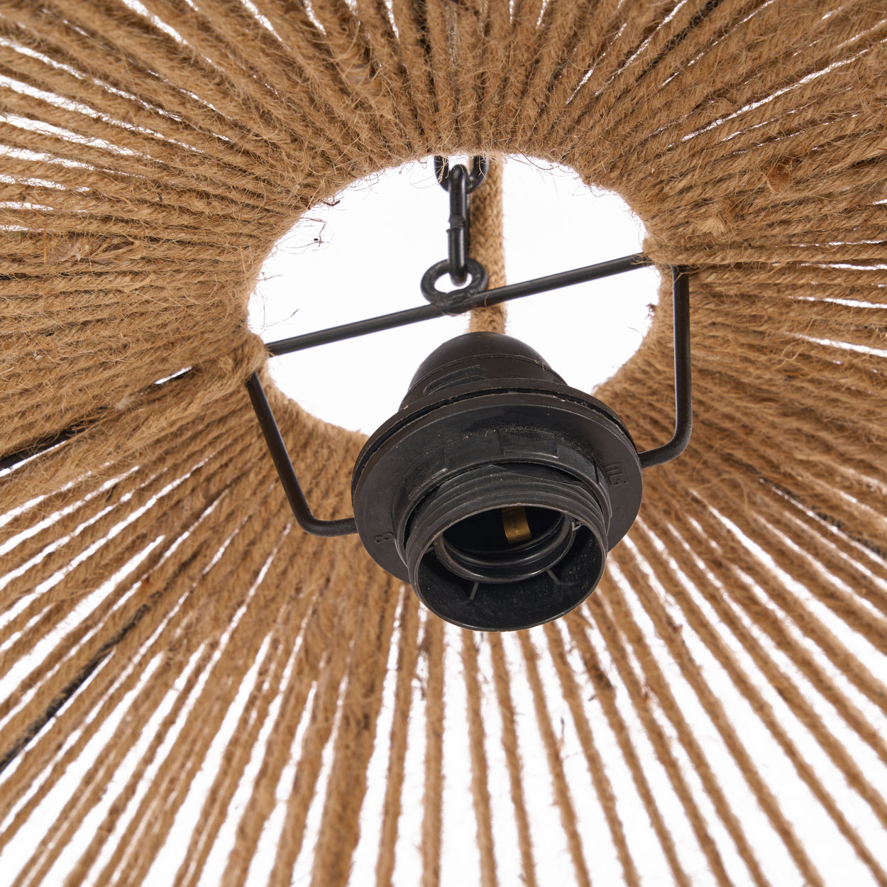 Close-up of a ceiling light fixture with a woven lampshade.