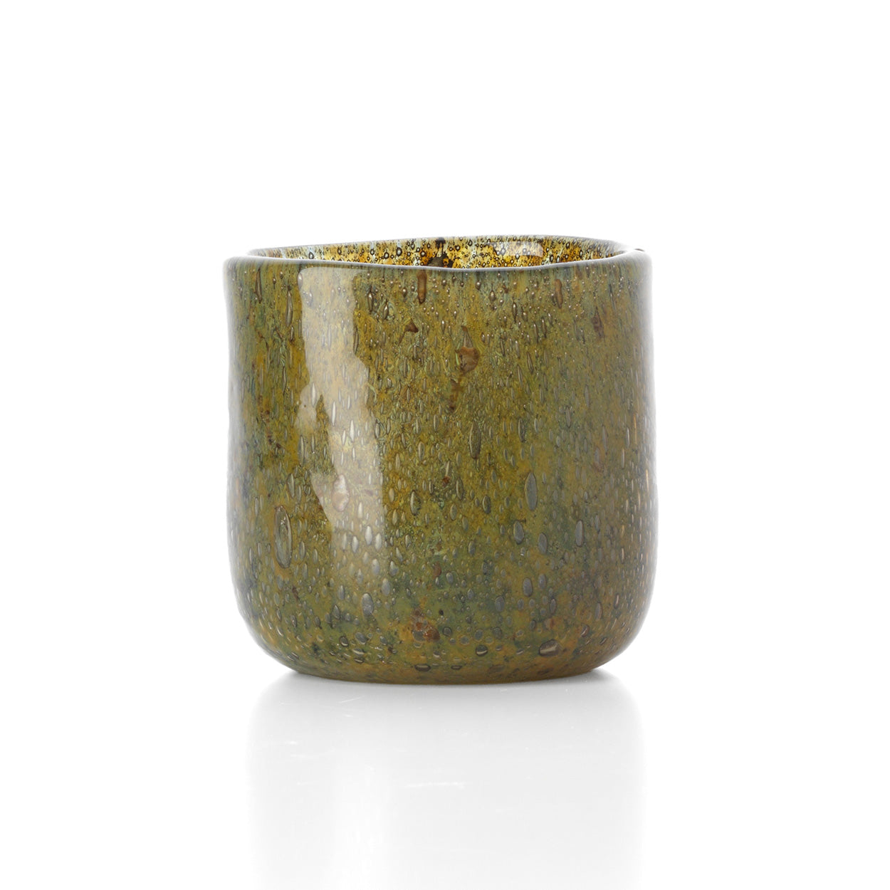 Green glass candle holder with speckled texture on a white background