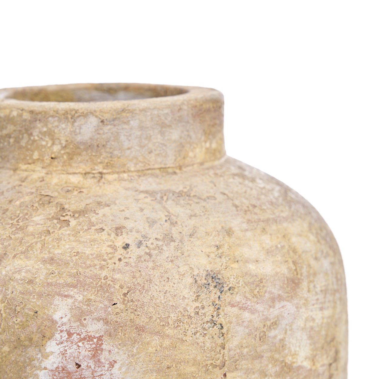 Close-up of a cream terracotta vase with a textured surface on a white background