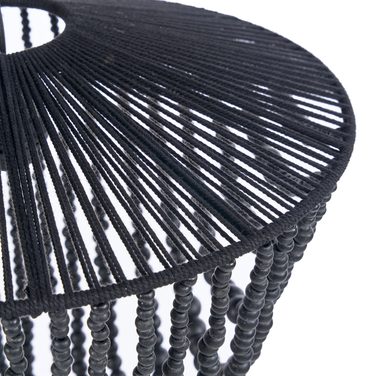 Close-up of a black beaded chandelier on a white background