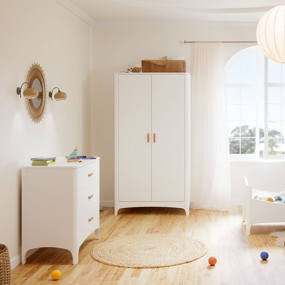 Children's room with NEREE Wardrobe 2D and toys on a wooden floor.