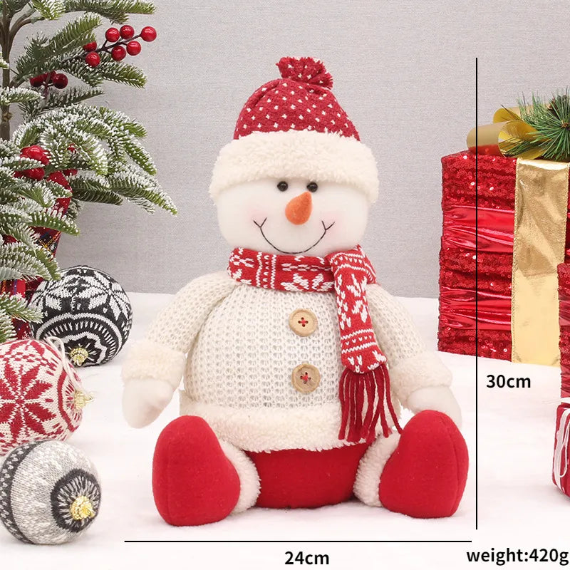 Rote sitzende Weihnachtspuppen für Zuhause