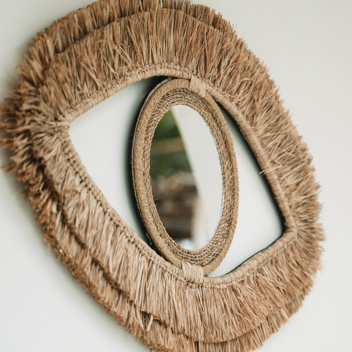 THE RAFFIA EYE Mirror half-front view