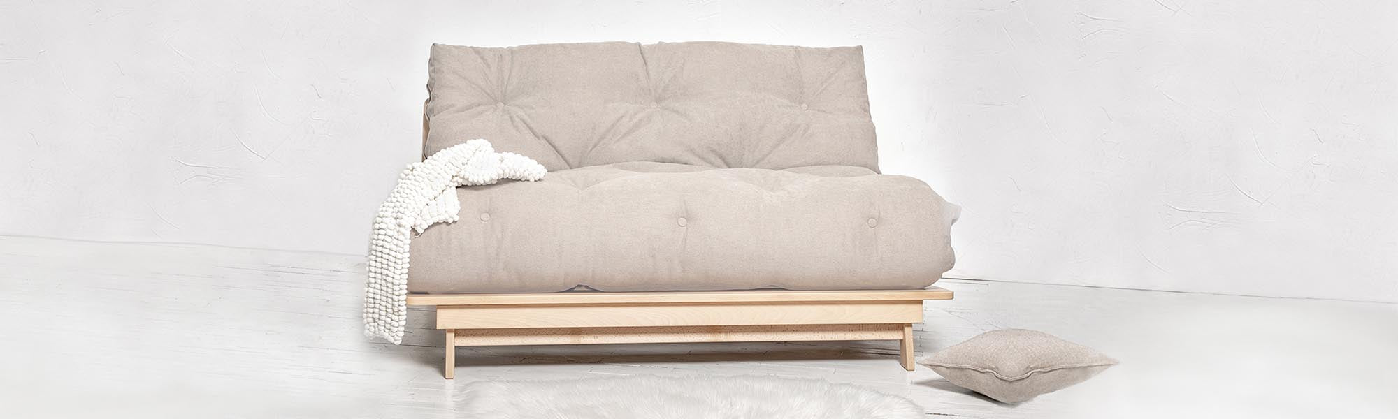 Double seats futon on a wooden frame with a beige mattress