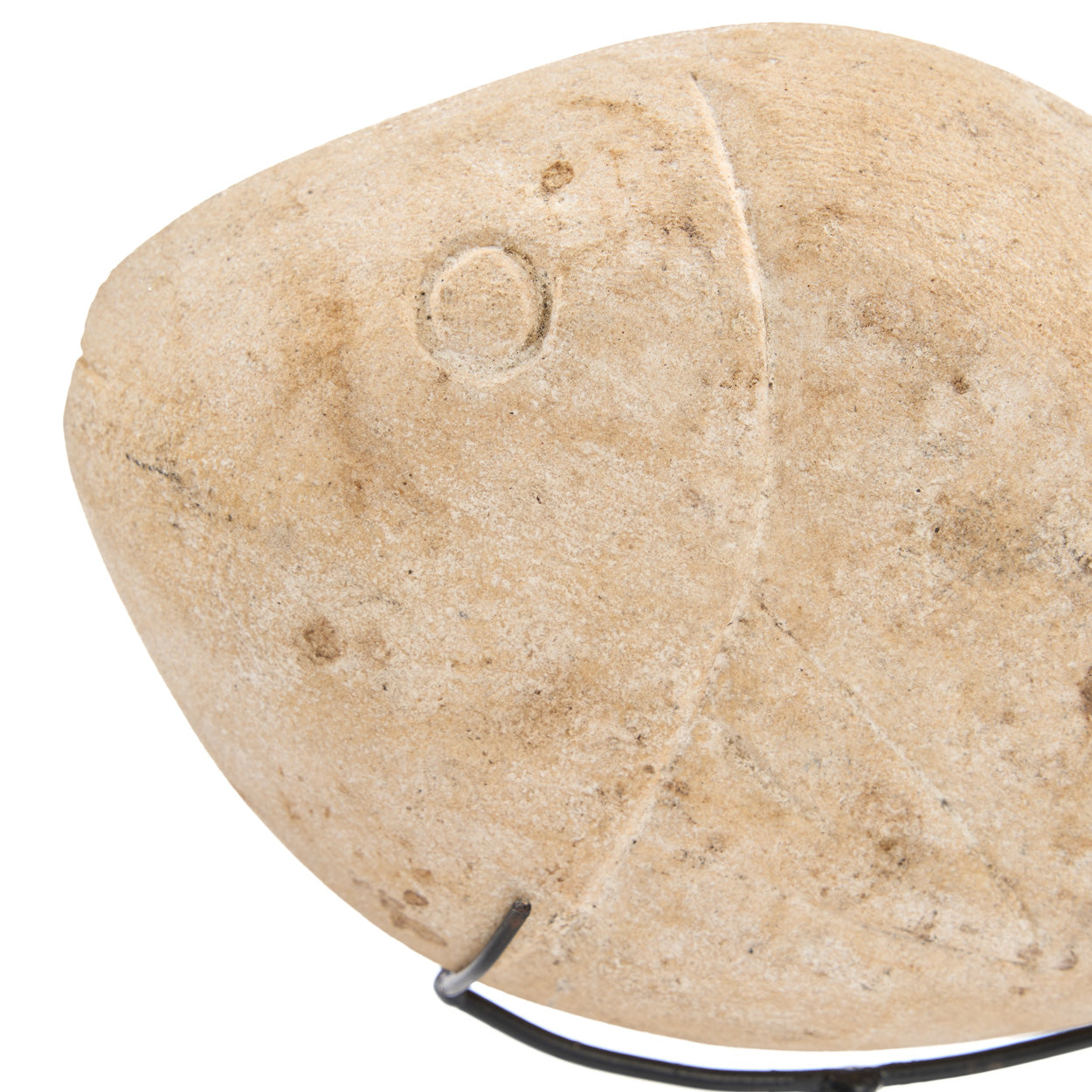 Beige stone fish on a white background