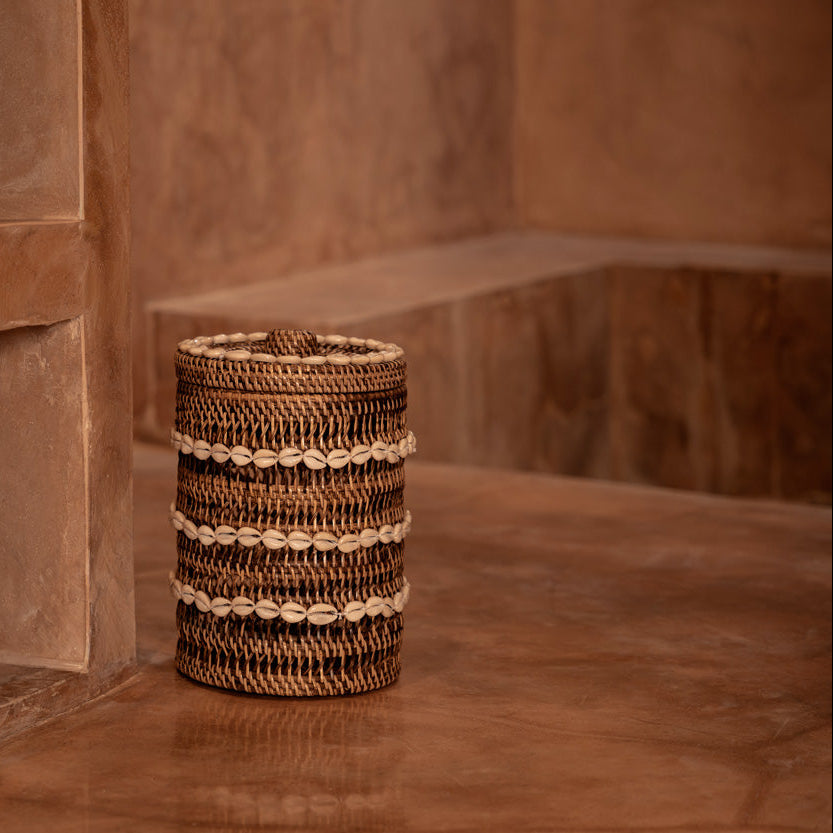 Woven rattan basket on a stone surface