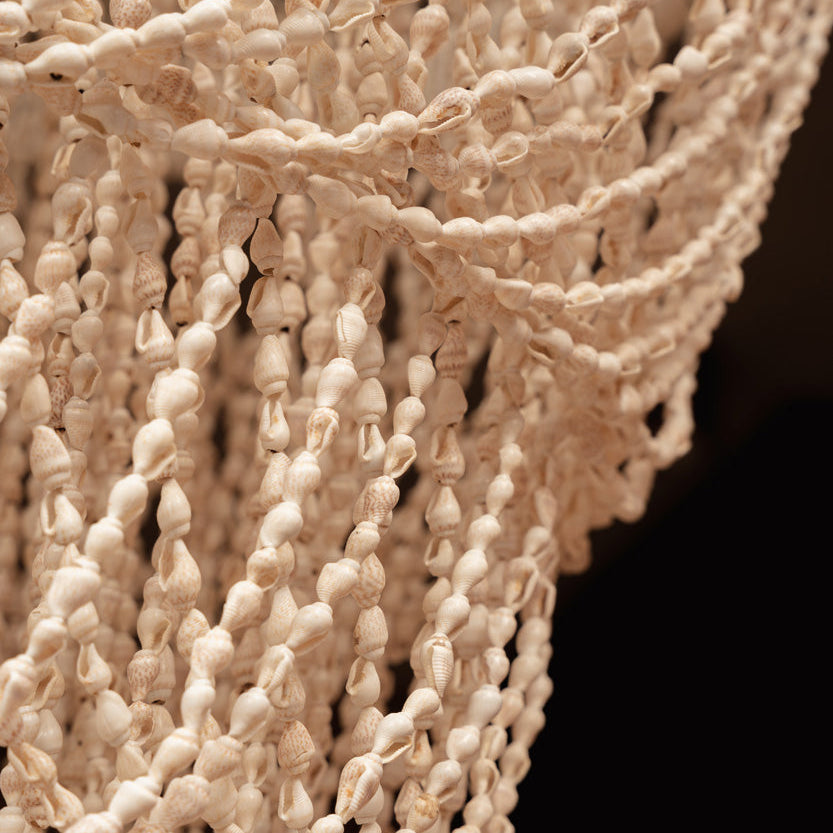 Close-up of a textured beige fabric of chandelier