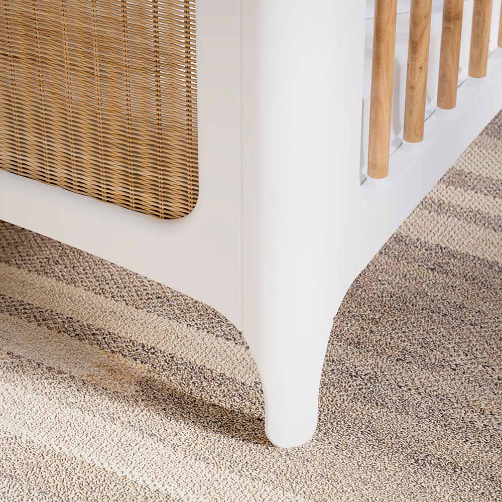 Close-up of a NEREIDES LIT Bed 60X120 - Neige on a textured beige carpet.